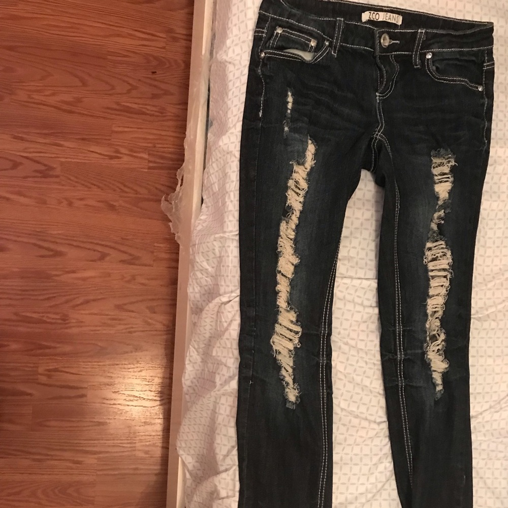Dark wash ripped jeans.